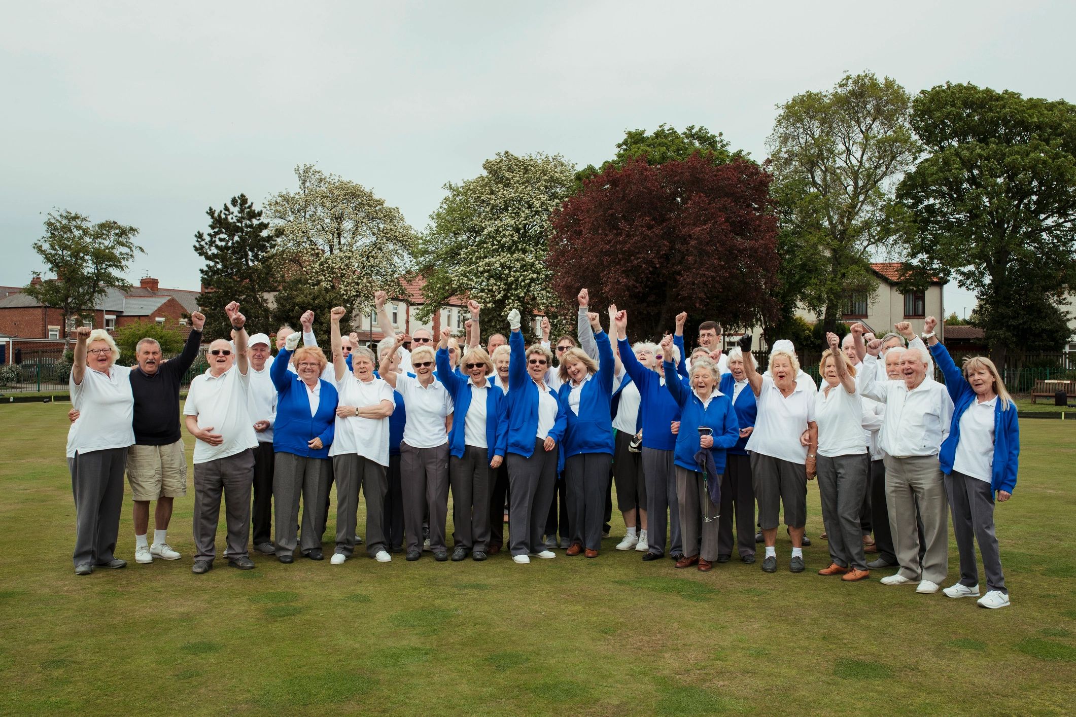 Community group celebrating together outdoors