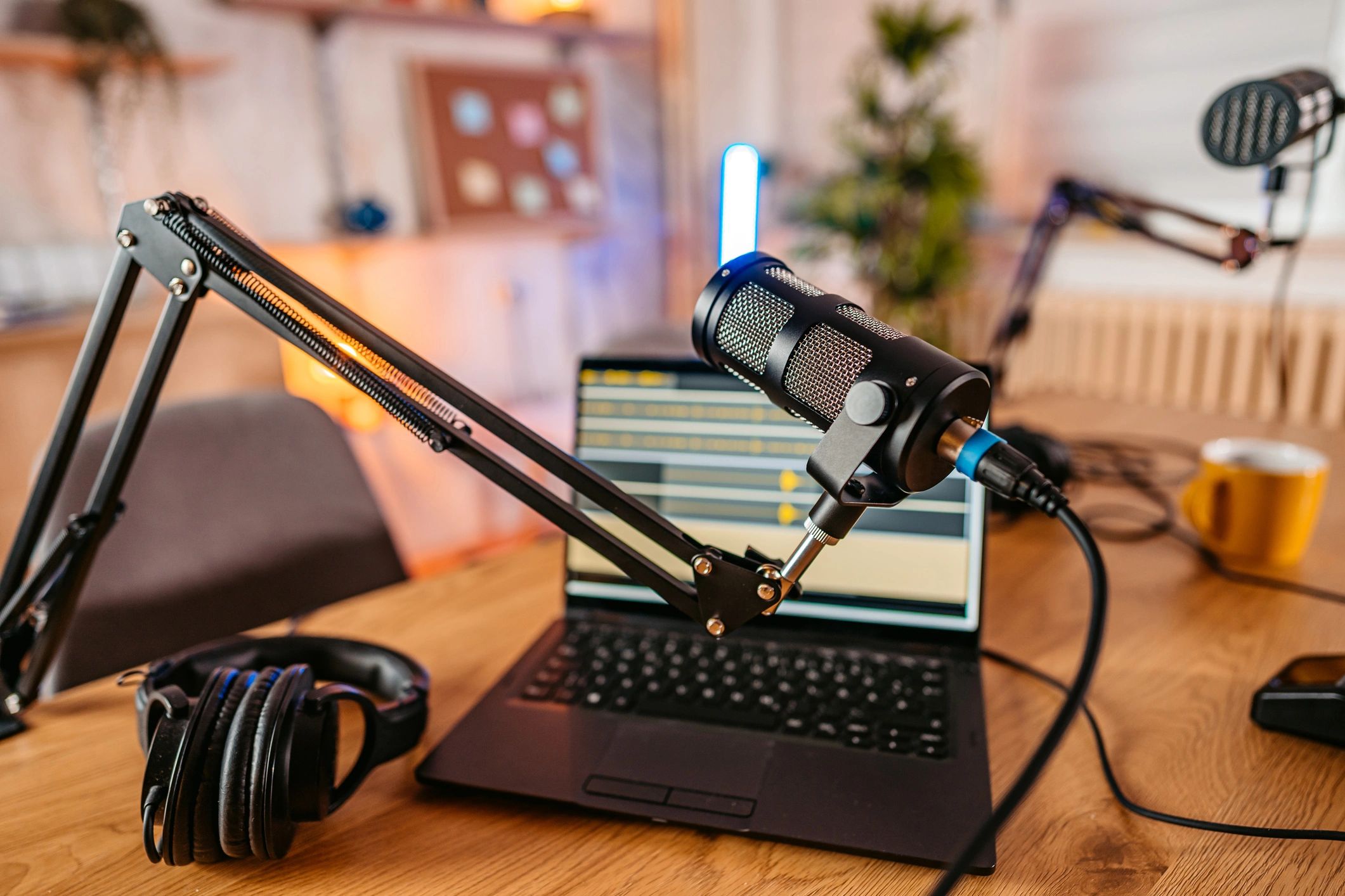 Studio microphone with laptop in the background