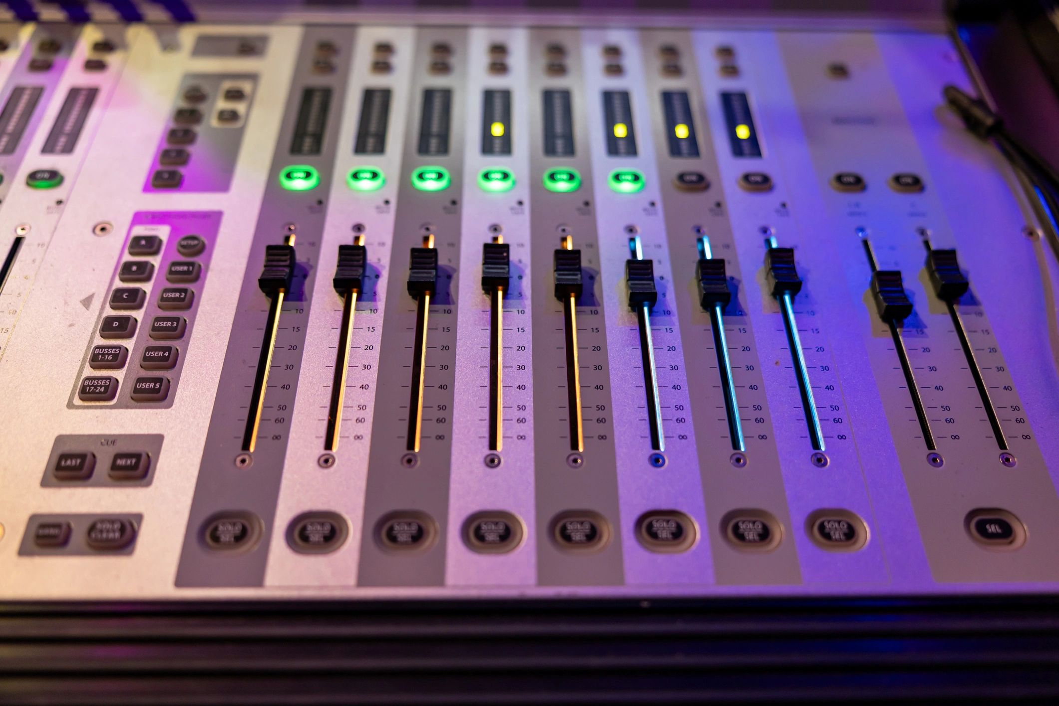 Digital sound mixing console with illuminated buttons