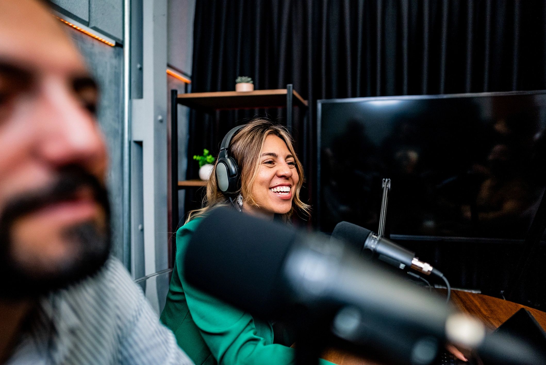 Radio presenter speaking into a studio microphone