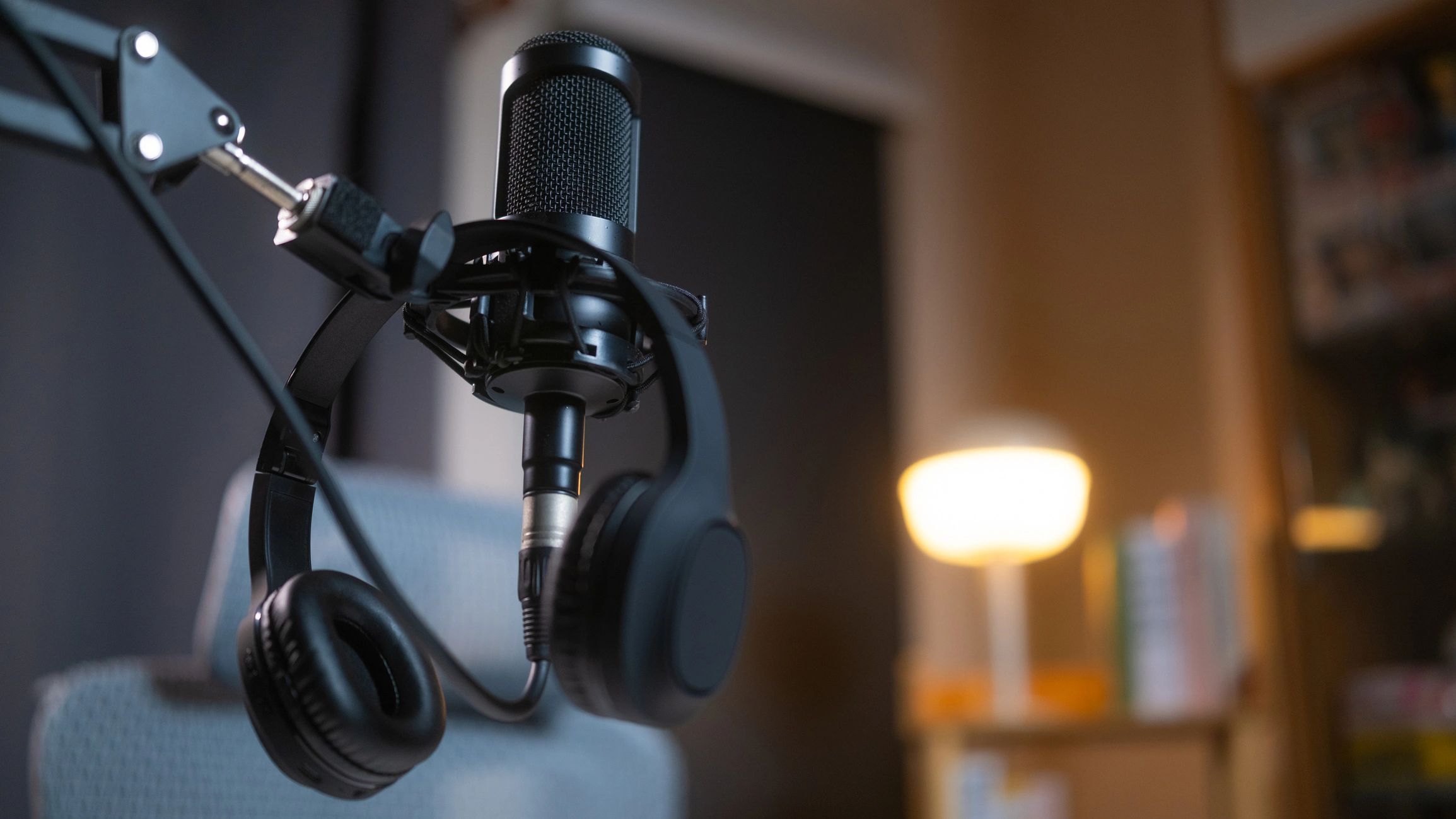 Broadcast microphone with headphones in a modern studio