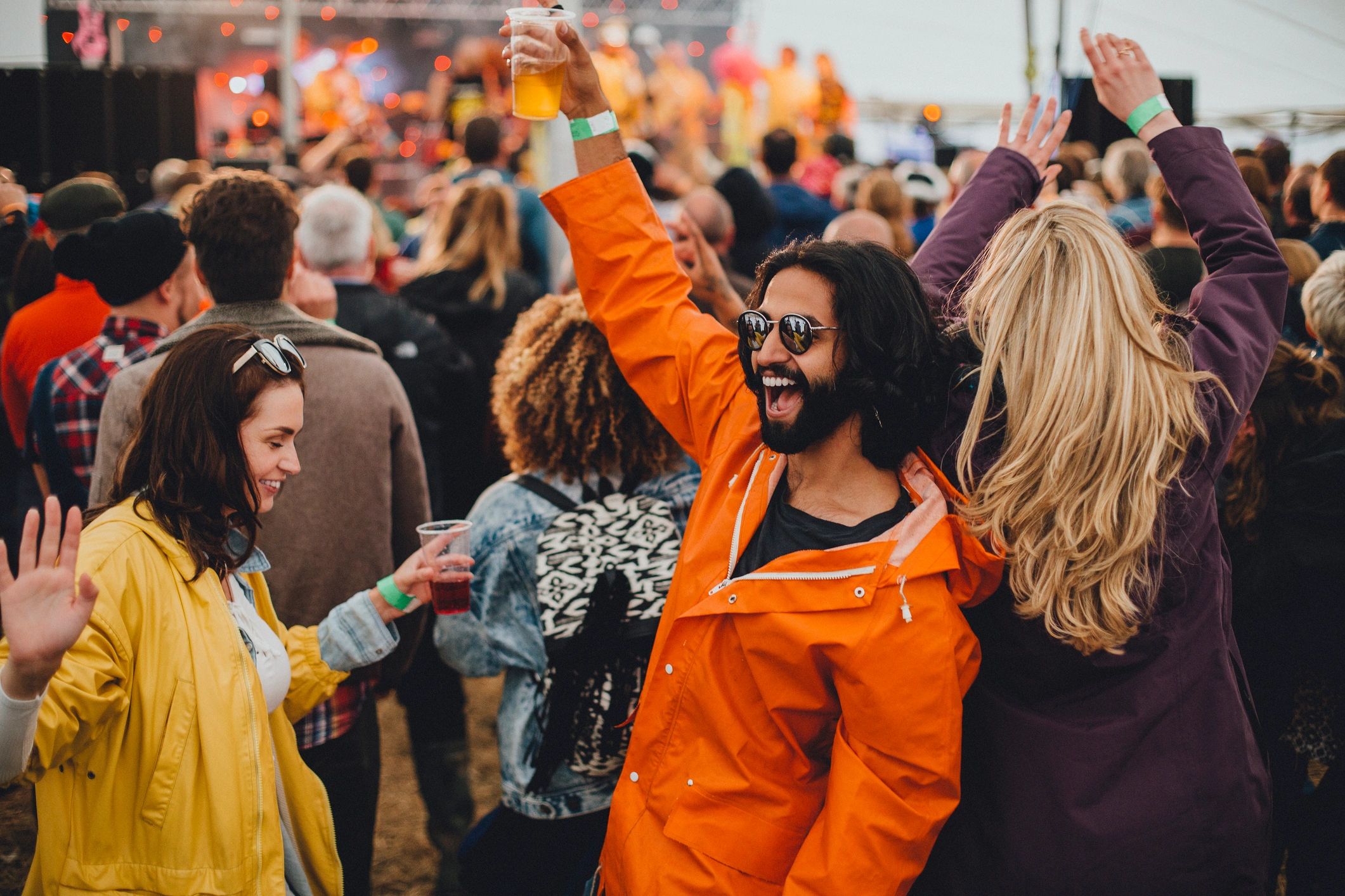 People dancing together at a music festival